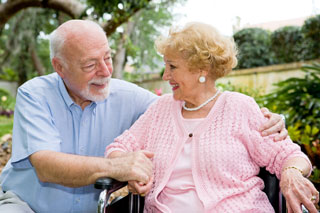An elderly couple in conversation in a park