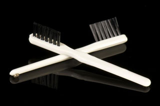 Two hearing aid cleaning brushes