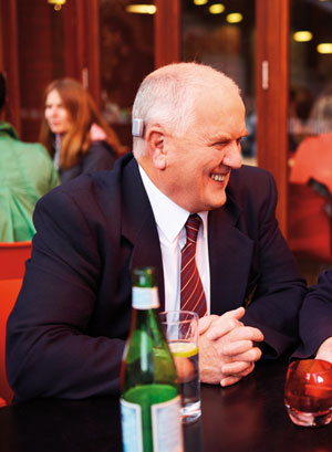 A BAHA hearing aid on a man at a restaurant